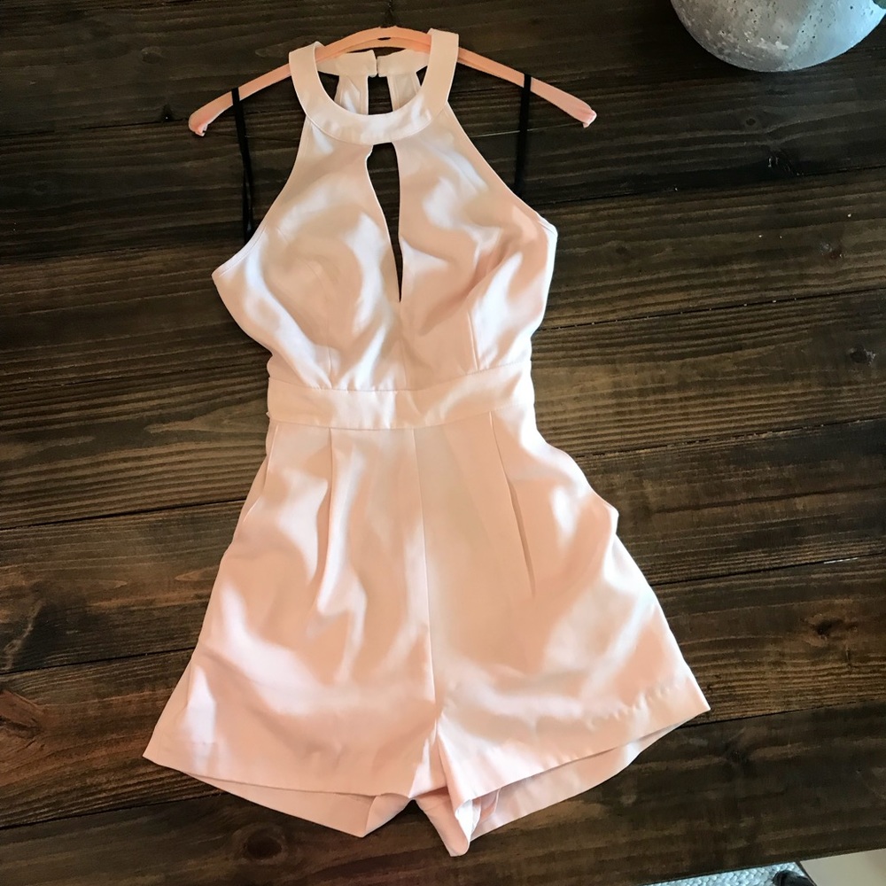 Blush pink Bebe Romper.  Size 0.  NWT